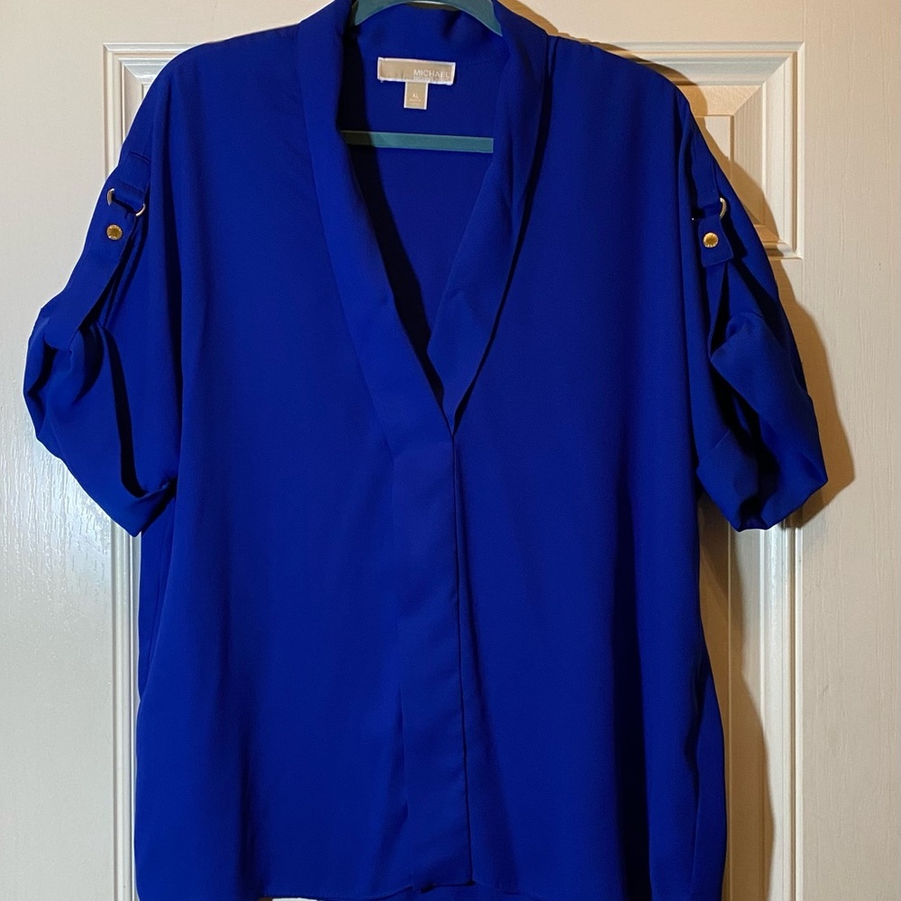 Michael Kors Women’s royal blue blouse with gold accents on the sleeves.